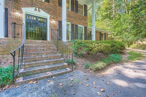 a front view of a house with stairs