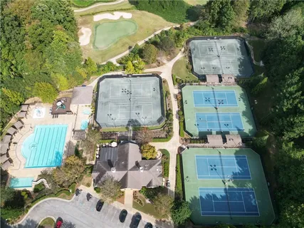 an aerial view of residential houses with outdoor space