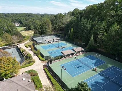 an aerial view of a house with pool garden and mountain view
