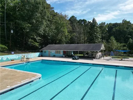 a view of a swimming pool with lounge chair