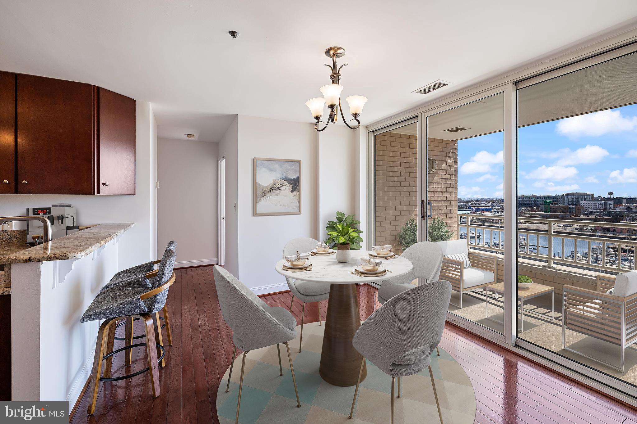 100 Harborview Drive, Unit 910 Baltimore, MD 21230 - Photo 5 of 44 Kitchen with dining space - staged