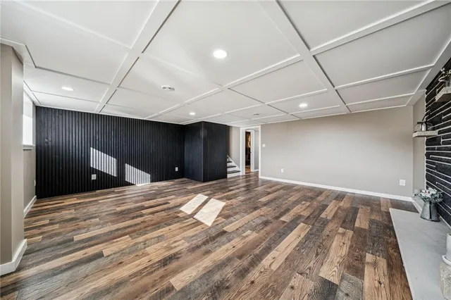 a view of an empty room with a fireplace