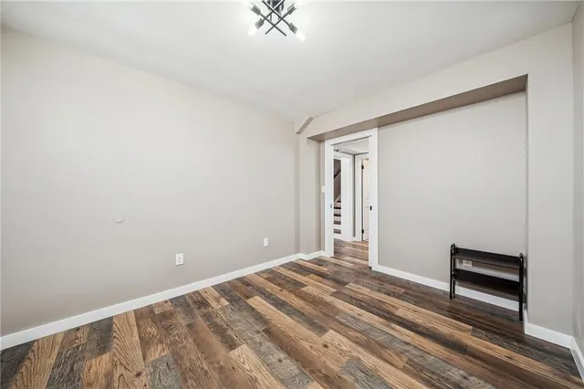 a view of room with window and hardwood floor