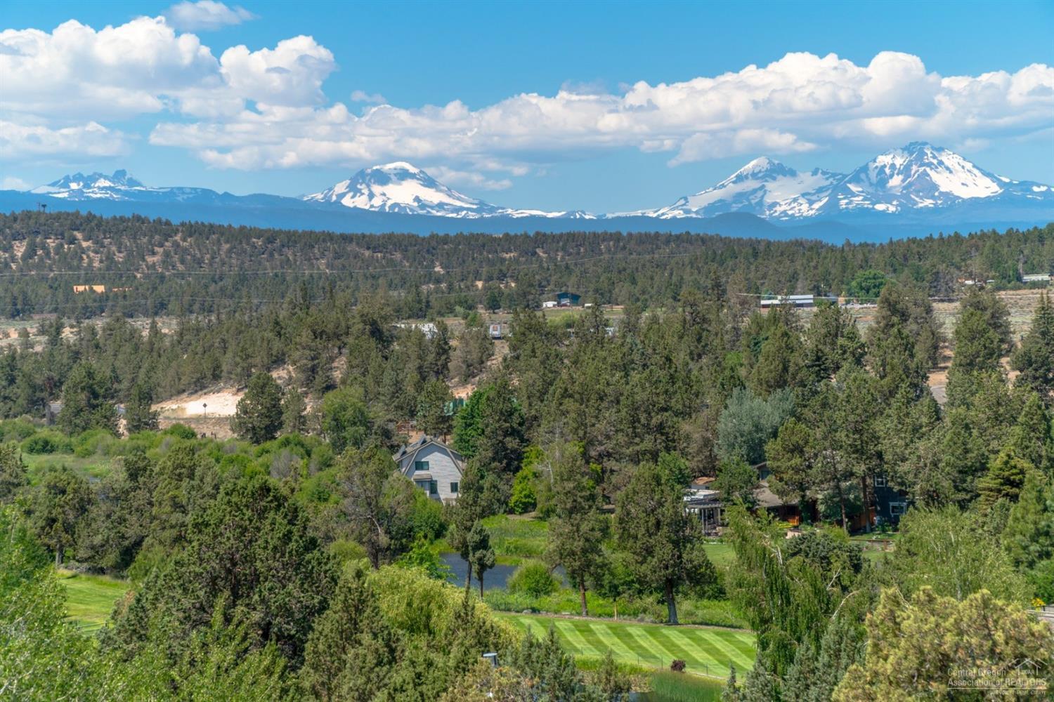 20152 Tumalo Road Bend, OR 97703 - Photo 2 of 25 a view of a lake in middle of forest