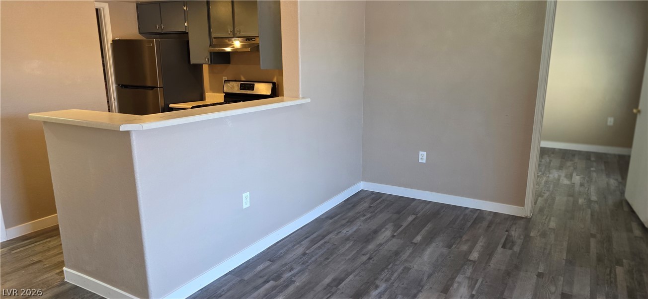 1830 North Pecos Road, Unit 142 Las Vegas, NV 89115 - Photo 9 of 19 A well-appointed kitchen features stainless steel appliances and wood-look flooring.