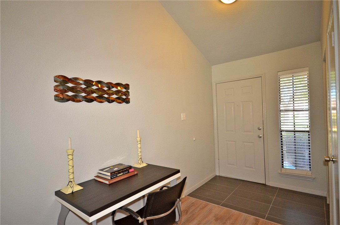 1601 Faro Drive, Unit 201 Austin, TX 78741 - Photo 18 of 24 a room with furniture and window