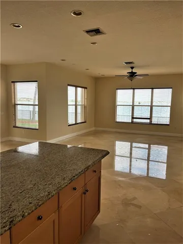 a view of a kitchen cabinets and a counter top space