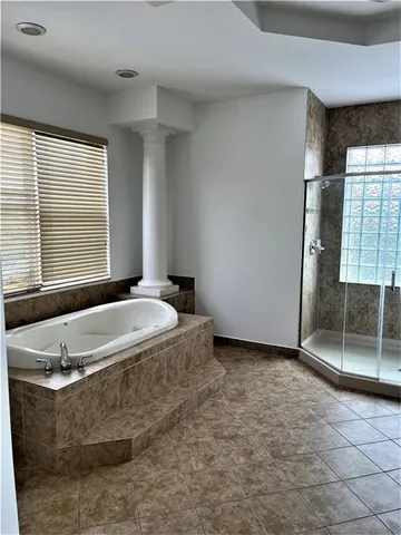 a kitchen with white cabinets and sink