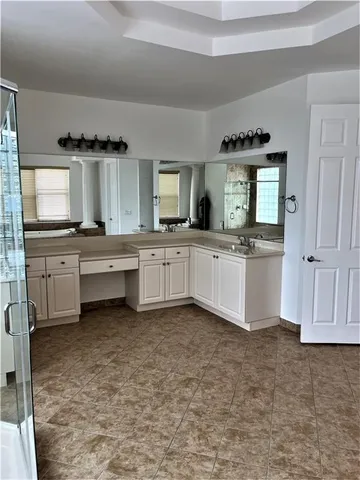 a view of kitchen with granite countertop cabinets and outdoor space