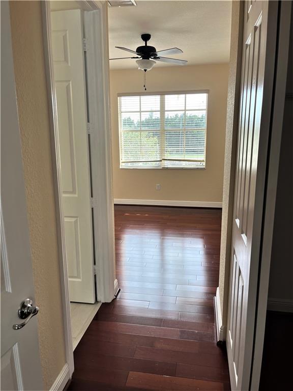 17989 Southwest 54th Street Miramar, FL 33029 - Photo 28 of 53 a view of empty room with wooden floor and fan