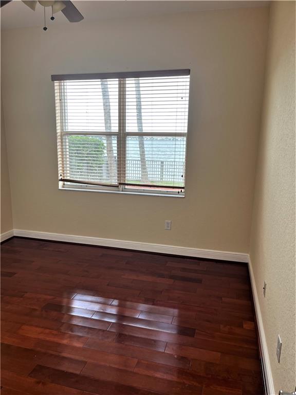 17989 Southwest 54th Street Miramar, FL 33029 - Photo 32 of 53 an empty room with wooden floor and windows