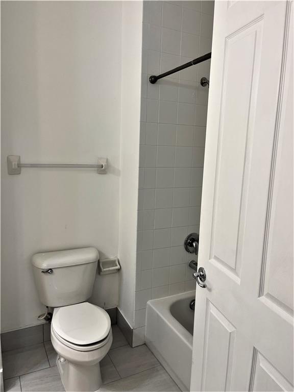 17989 Southwest 54th Street Miramar, FL 33029 - Photo 36 of 53 a white toilet sitting next to a bathtub