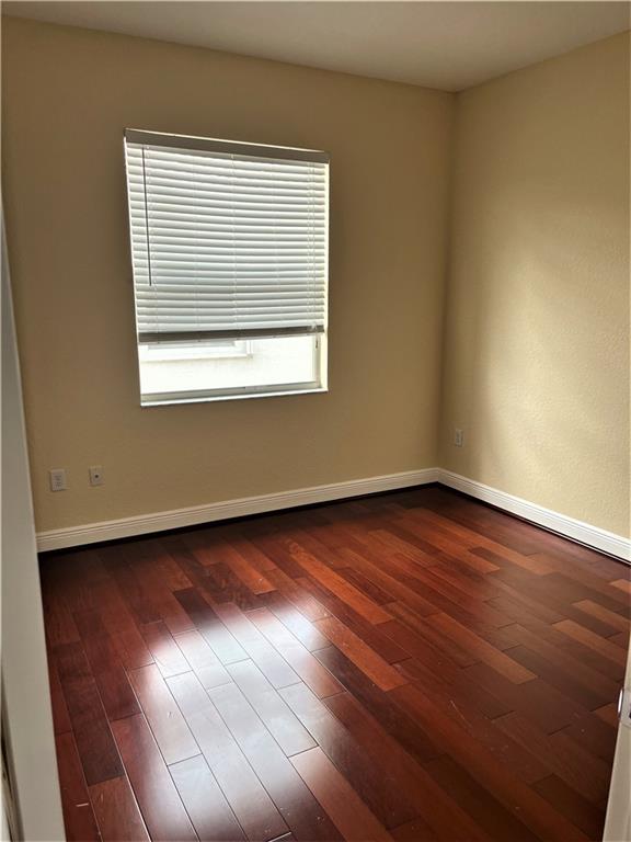 17989 Southwest 54th Street Miramar, FL 33029 - Photo 37 of 53 an empty room with wooden floor and windows