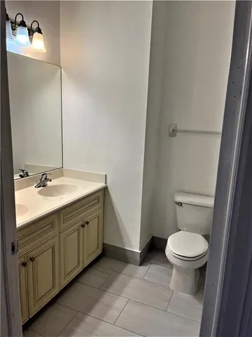 a bathroom with a toilet a sink and bathtub