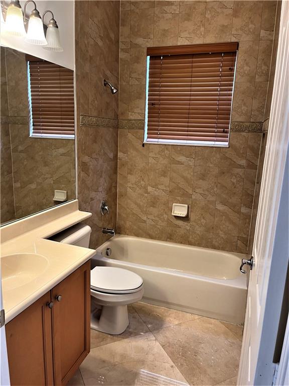 17989 Southwest 54th Street Miramar, FL 33029 - Photo 40 of 53 a bathroom with a toilet a sink and bathtub