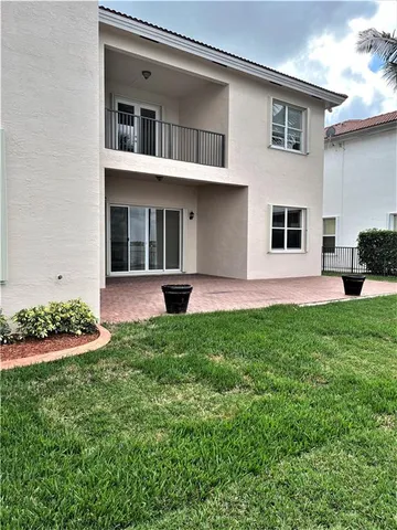 a utility room with sink dryer and washer