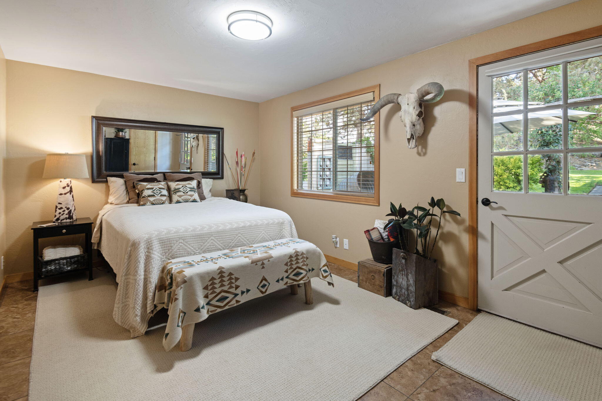 22539 Martee Lane Bend, OR 97701 - Photo 11 of 54 a bedroom with a bed and a large window