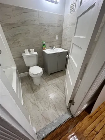 a bathroom with a toilet and a sink