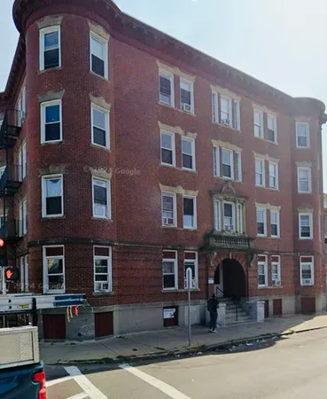 a front view of a building with lot of windows