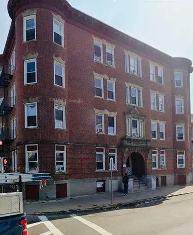 a front view of a building with lot of windows