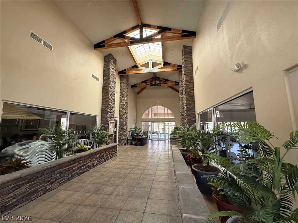 9050 West Warm Springs Road, Unit 2002 Las Vegas, NV 89148 - Photo 40 of 46 This grand foyer welcomes with soaring ceilings and natural light, setting an impressive tone.