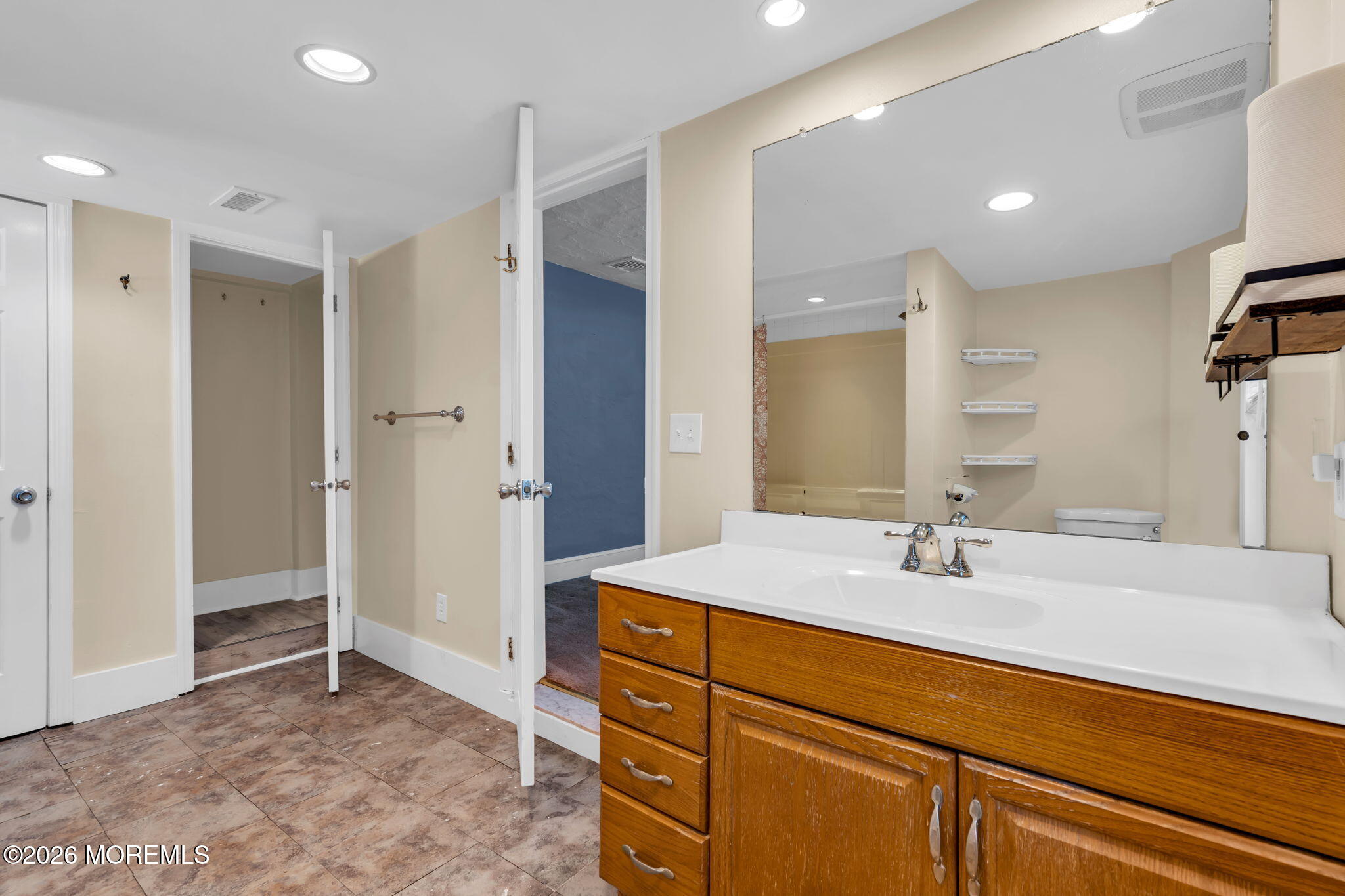 1431 Marconi Road Wall, NJ 07719 - Photo 23 of 36 a bathroom with a sink and a mirror