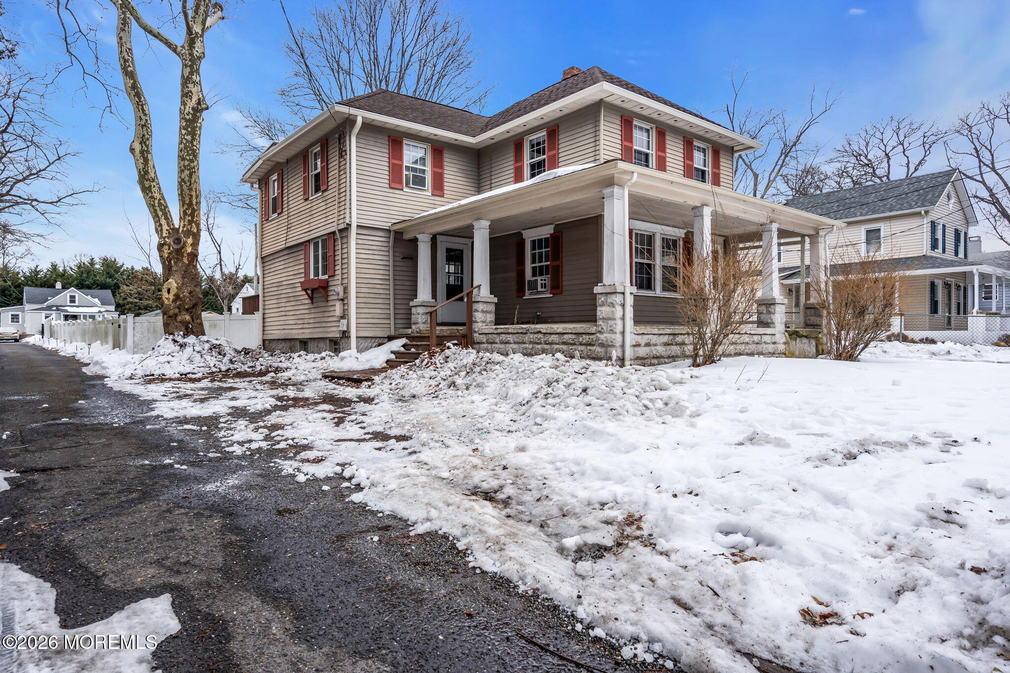 1431 Marconi Road Wall, NJ 07719 - Photo 3 of 36 a front view of a house with a yard covered in snow