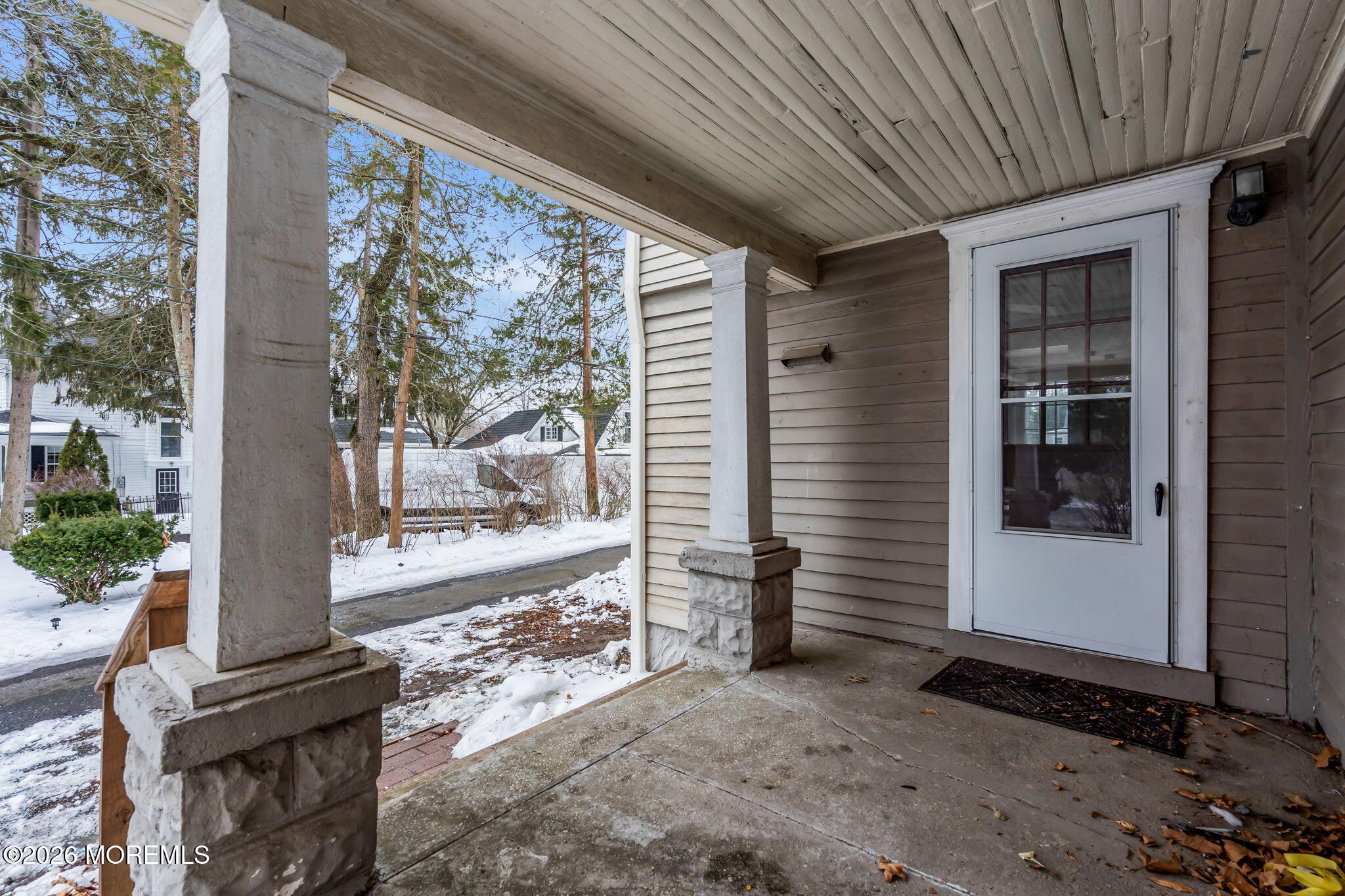 1431 Marconi Road Wall, NJ 07719 - Photo 7 of 36 a view of a porch with furniture and floor to ceiling window