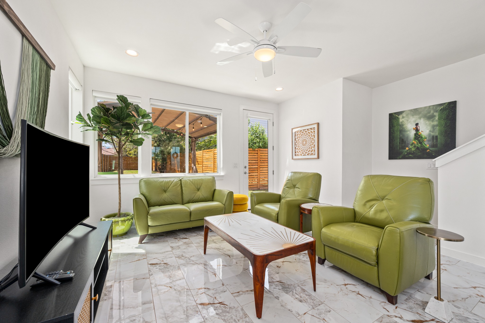 1190 Sarabeth Way Austin, TX 78721 - Photo 9 of 22 Polished tile flooring and large windows create a bright, inviting living space.