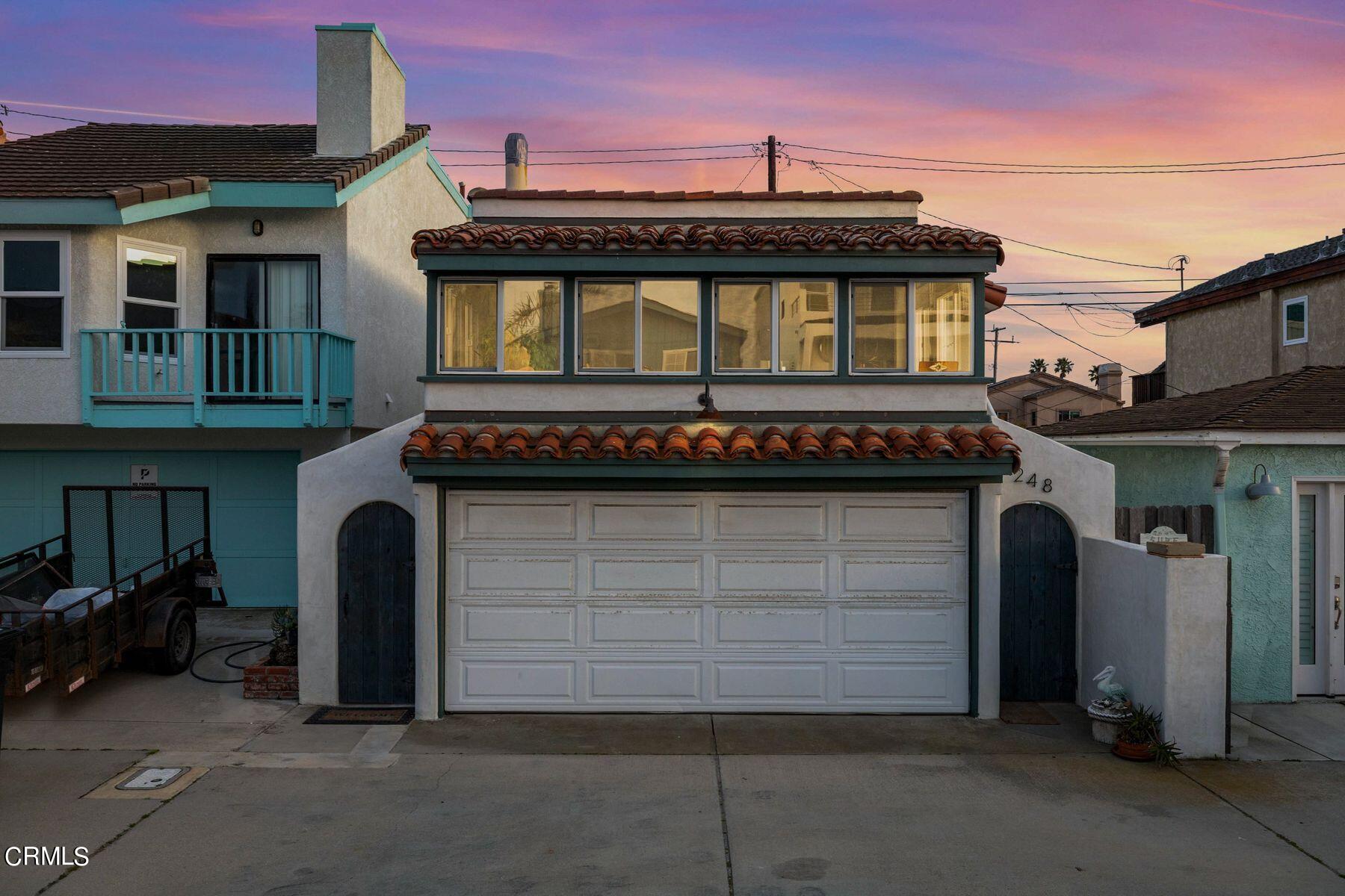 a front view of a house with a garage