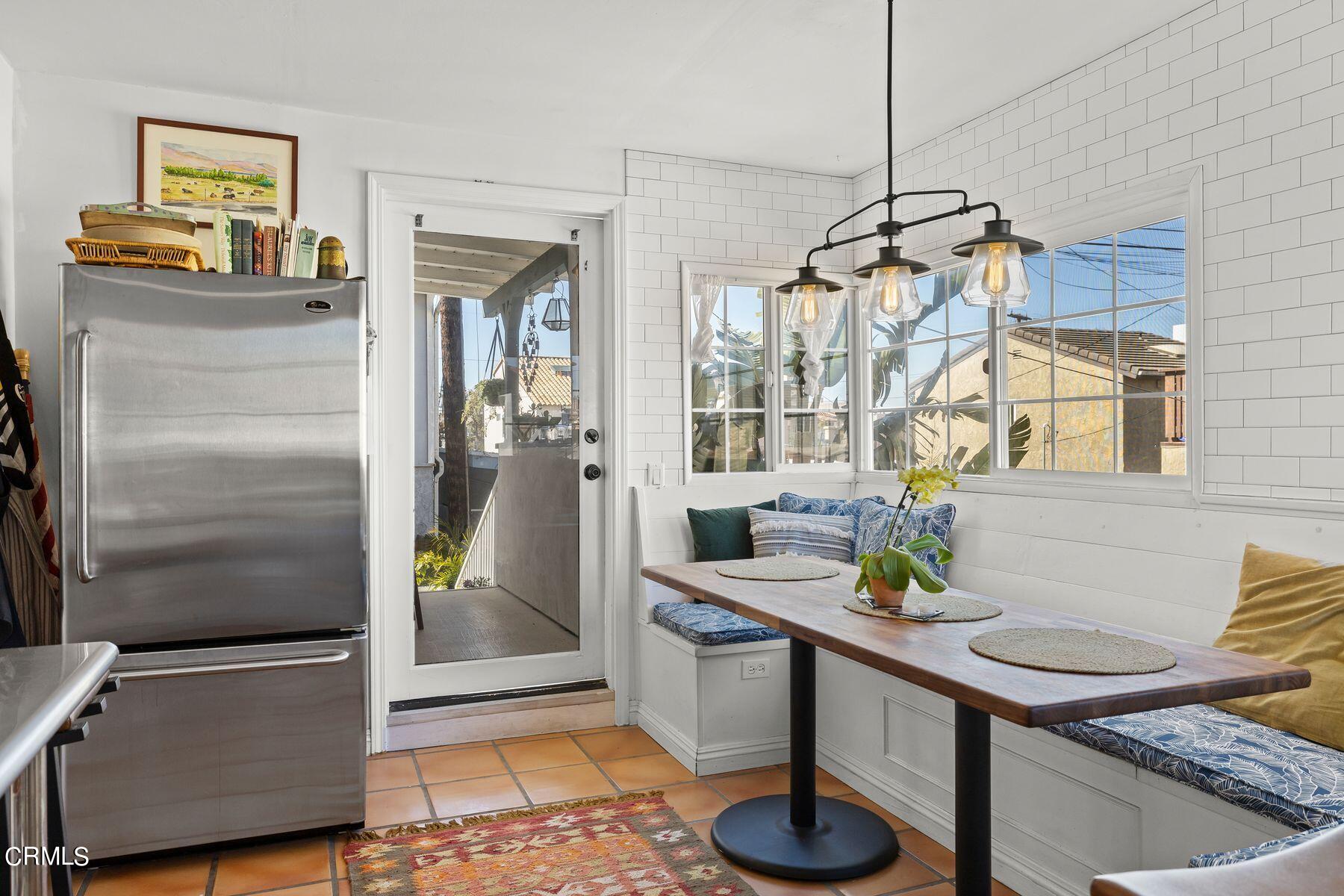 248 Cahuenga Drive Oxnard, CA 93035 - Photo 11 of 28 a living room with furniture and a chandelier
