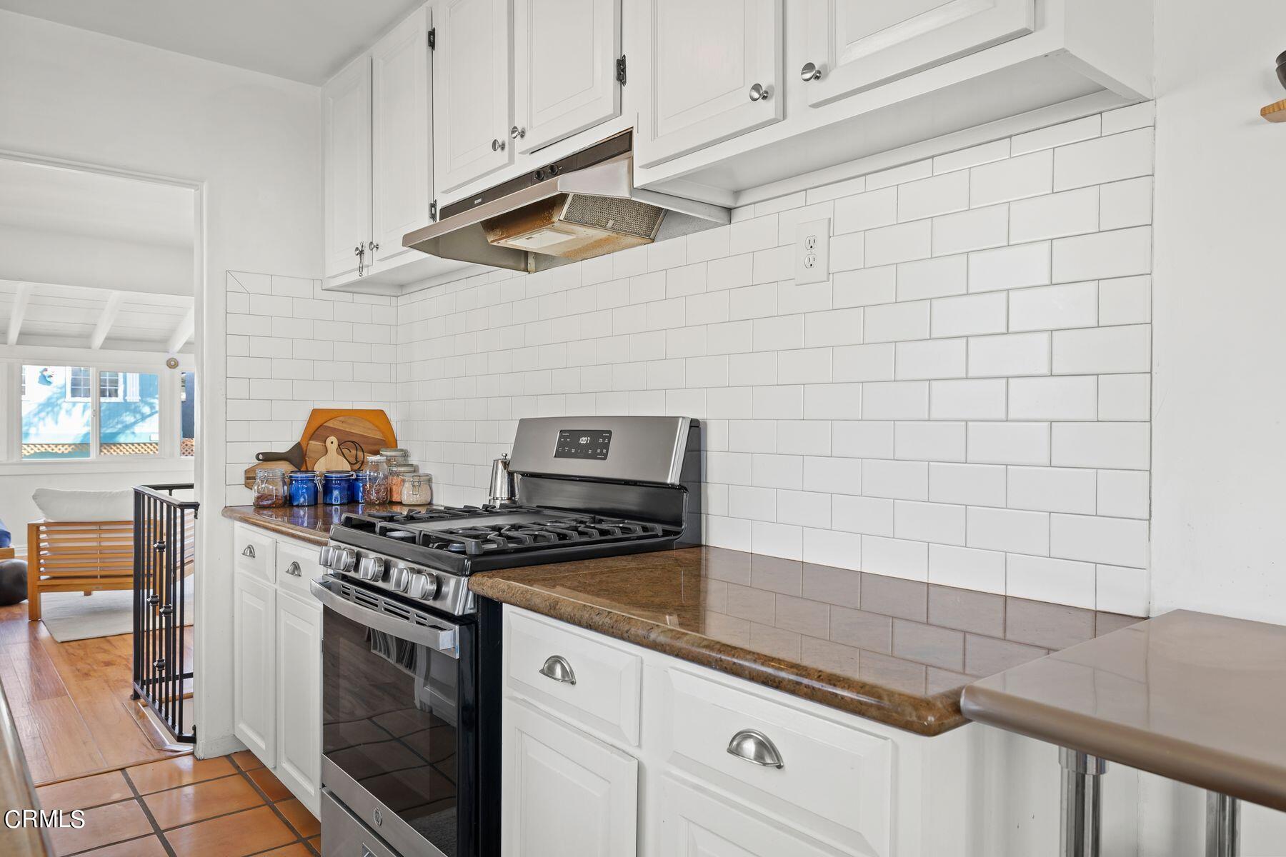 248 Cahuenga Drive Oxnard, CA 93035 - Photo 12 of 28 a kitchen with stainless steel appliances granite countertop a stove and a cabinets