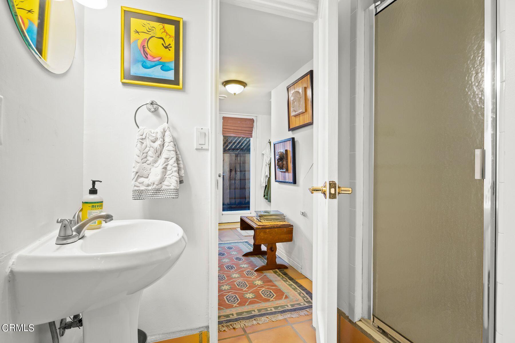 248 Cahuenga Drive Oxnard, CA 93035 - Photo 16 of 28 a bathroom with a sink and a mirror