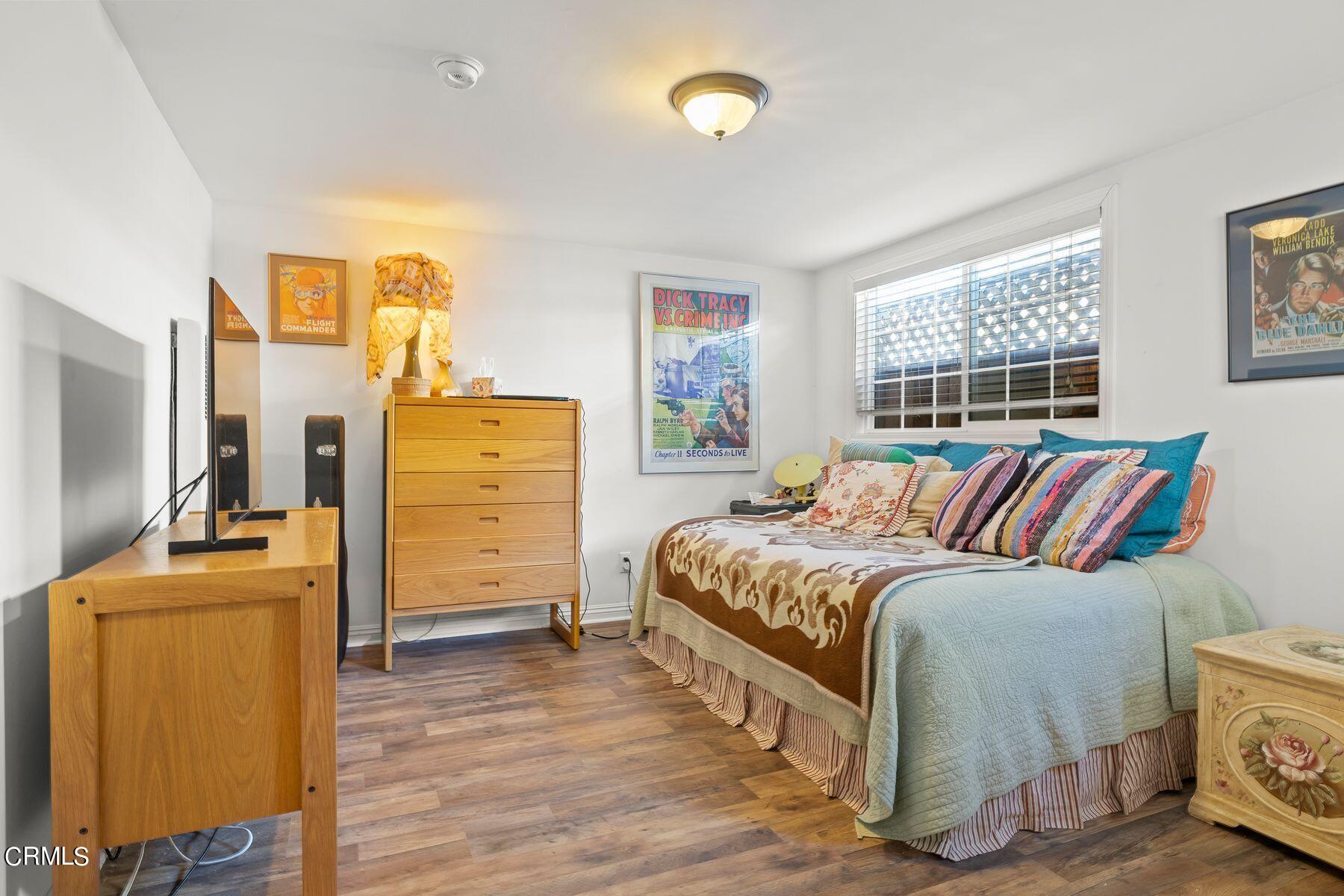 248 Cahuenga Drive Oxnard, CA 93035 - Photo 17 of 28 a bedroom with a bed and wooden floor