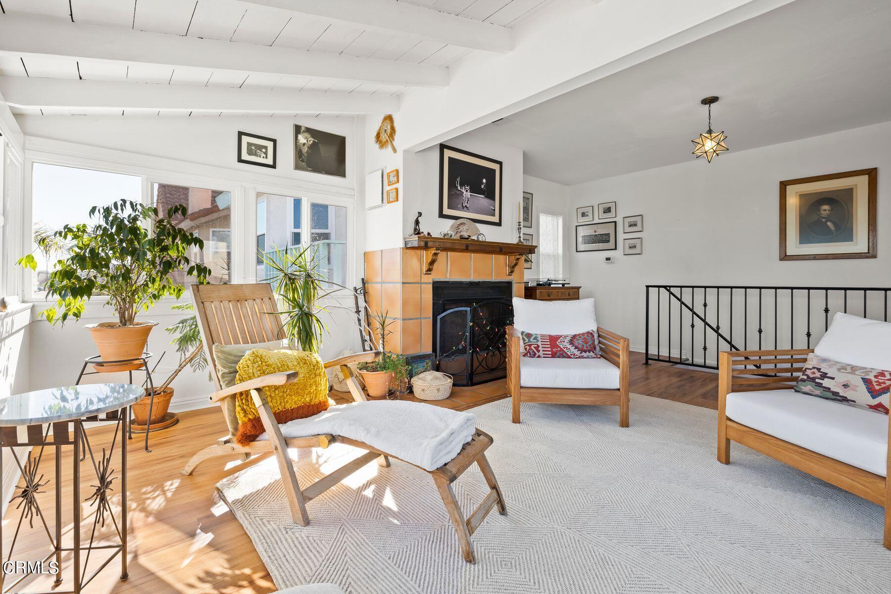 248 Cahuenga Drive Oxnard, CA 93035 - Photo 4 of 28 a living room with furniture and a fireplace