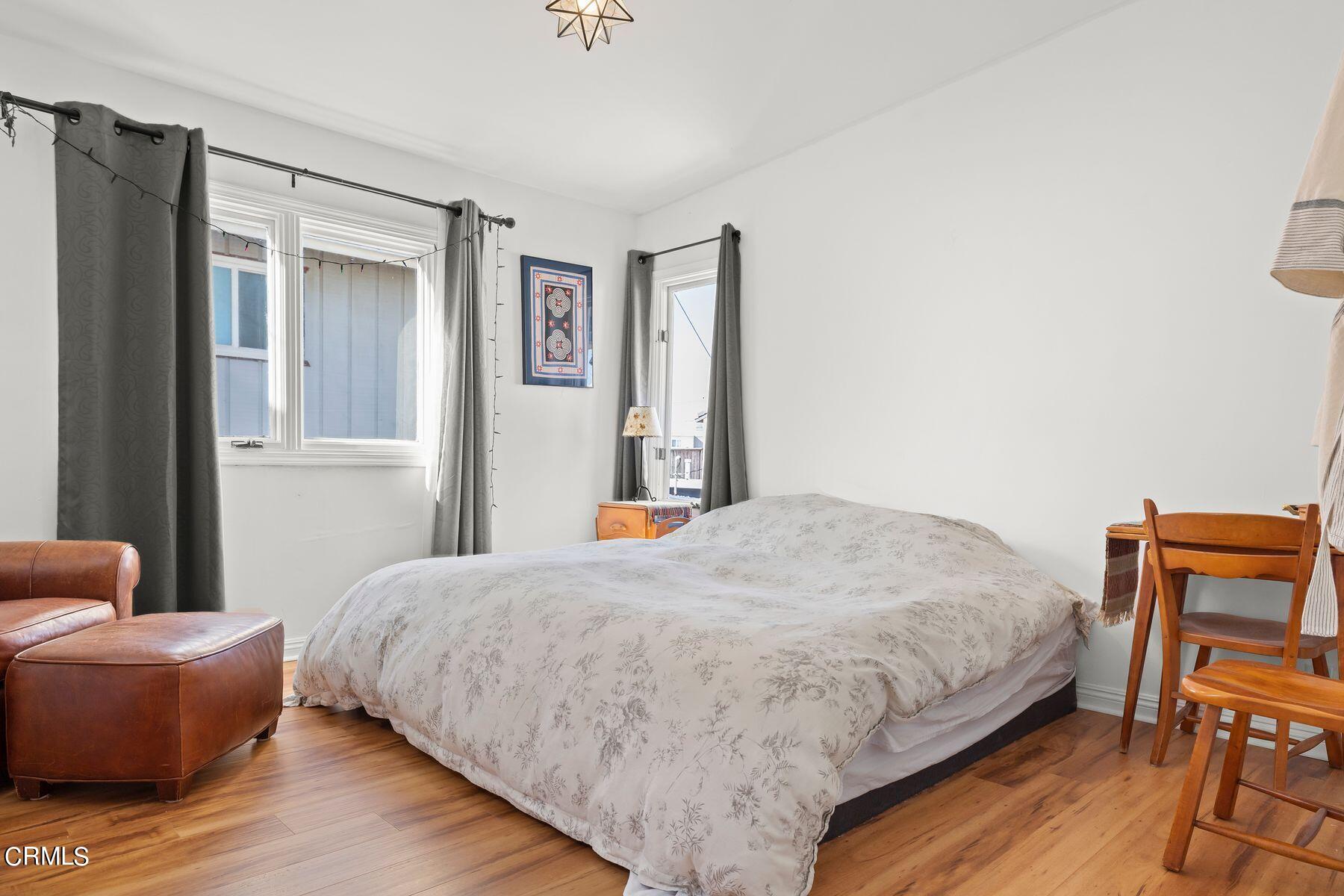 248 Cahuenga Drive Oxnard, CA 93035 - Photo 7 of 28 a bedroom with a bed and chair