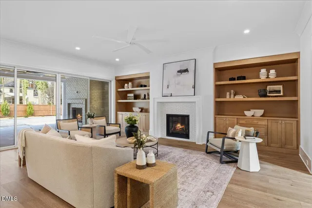 a view of a hallway with wooden floor and entryway