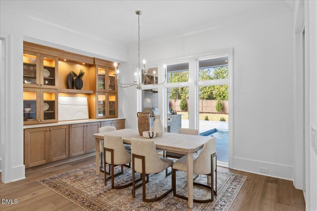 7309 Grist Mill Road Raleigh, NC 27615 - Photo 19 of 73 a view of a dining room with furniture window and outside view