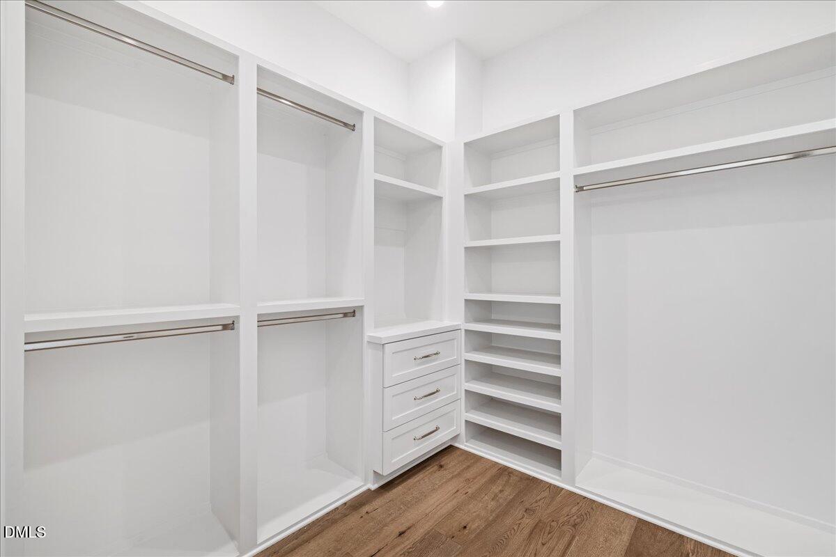 7309 Grist Mill Road Raleigh, NC 27615 - Photo 30 of 73 a view of walk in closet with empty racks