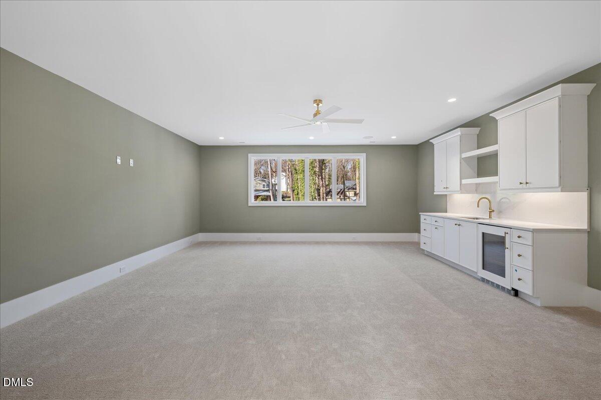 7309 Grist Mill Road Raleigh, NC 27615 - Photo 45 of 73 a view of a kitchen with stove and cabinets