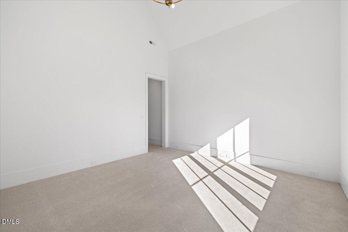 7309 Grist Mill Road Raleigh, NC 27615 - Photo 53 of 73 a view of a room with wooden floor