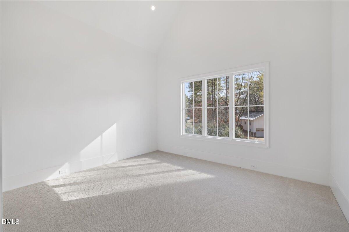 7309 Grist Mill Road Raleigh, NC 27615 - Photo 56 of 73 a view of an empty room with a window