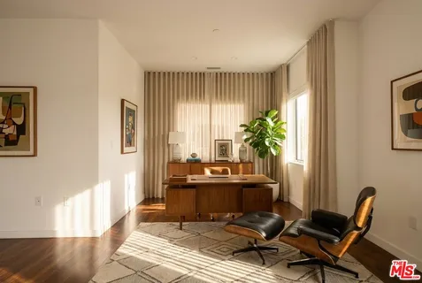 a workspace with furniture and a window
