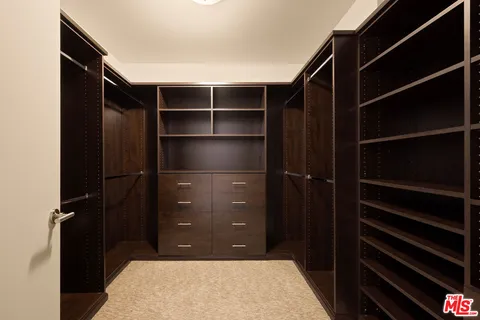 a bathroom with a walk in closet