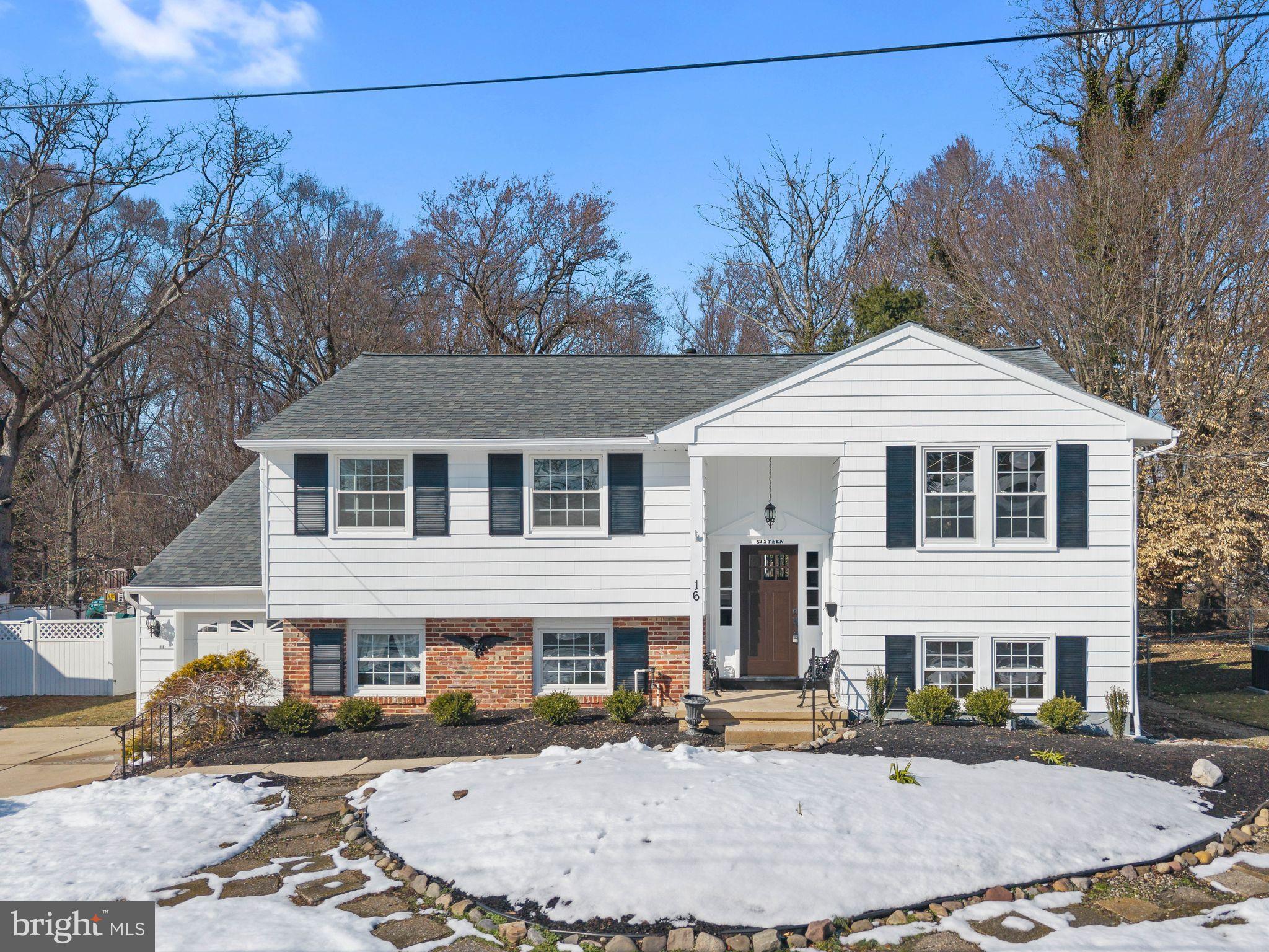 16 Saratoga Road Stratford, NJ 08084 - Photo 1 of 34 a front view of a house with a garden and trees