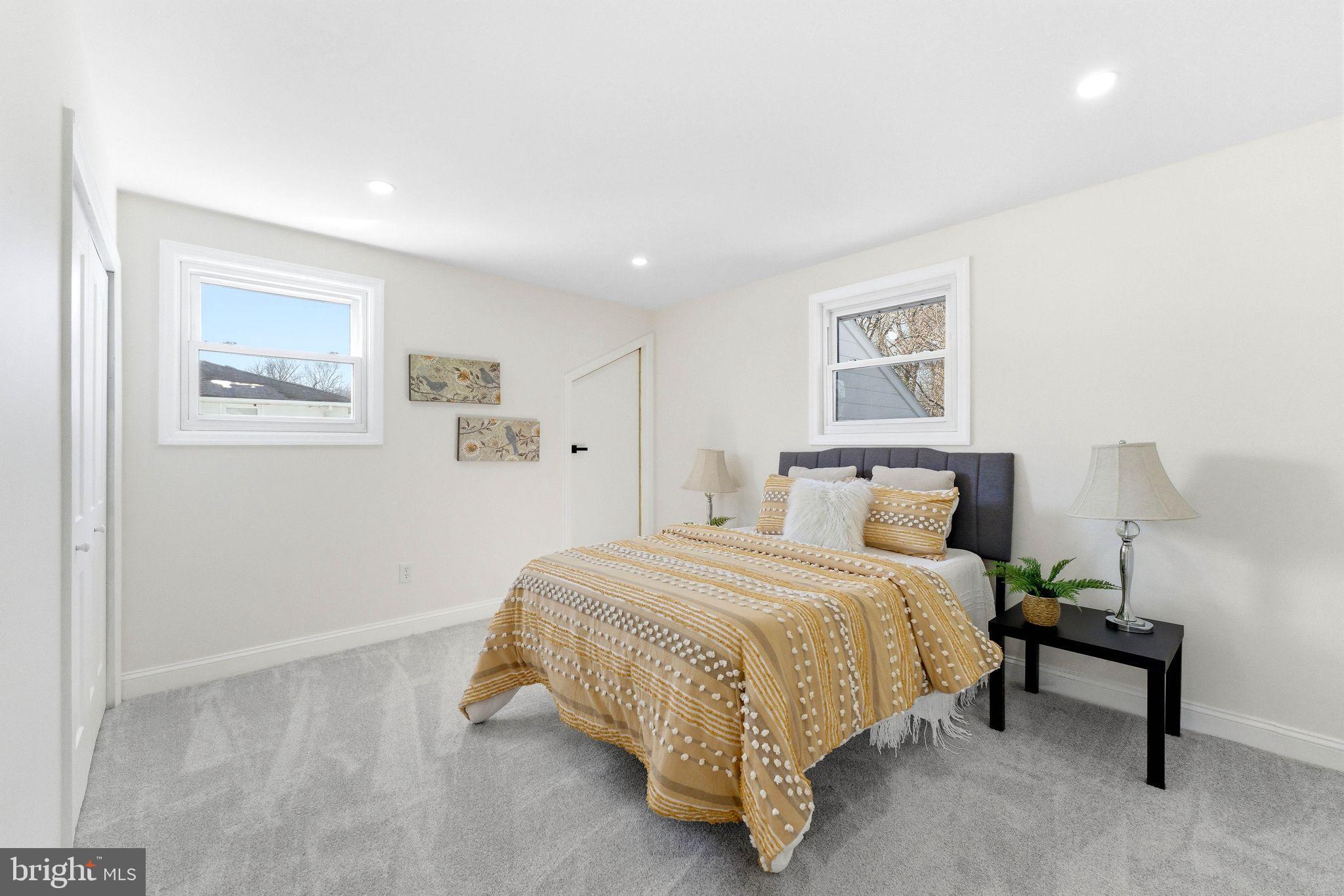 16 Saratoga Road Stratford, NJ 08084 - Photo 13 of 34 a bedroom with a bed and a wall painting