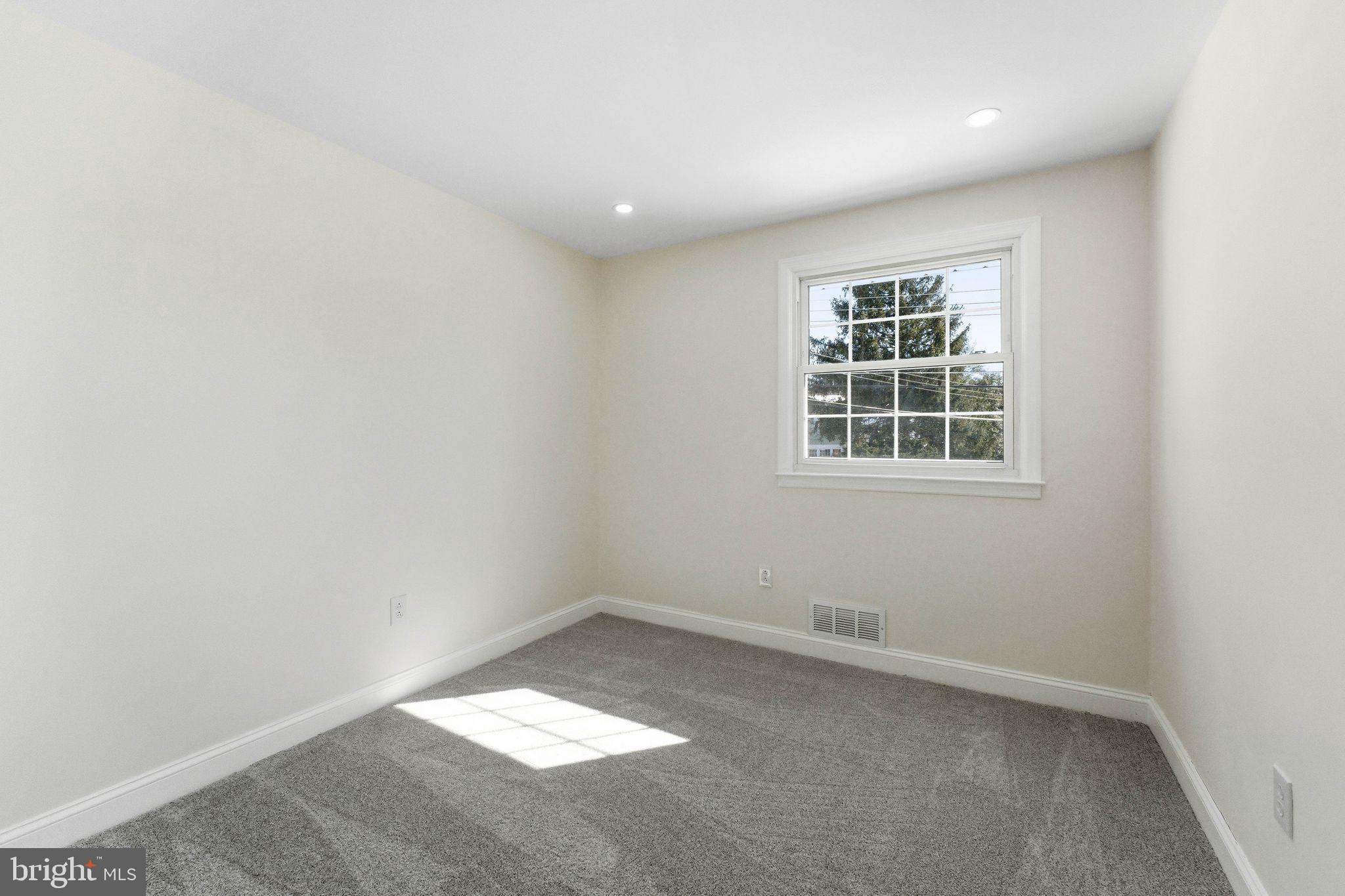 16 Saratoga Road Stratford, NJ 08084 - Photo 15 of 34 an empty room with a window