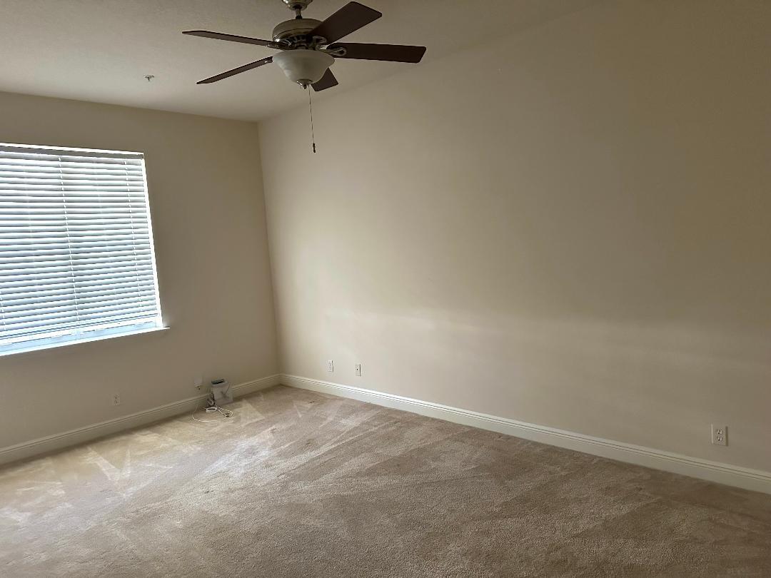 808 University Boulevard Jupiter, FL 33458 - Photo 11 of 16 a view of an empty room with a window