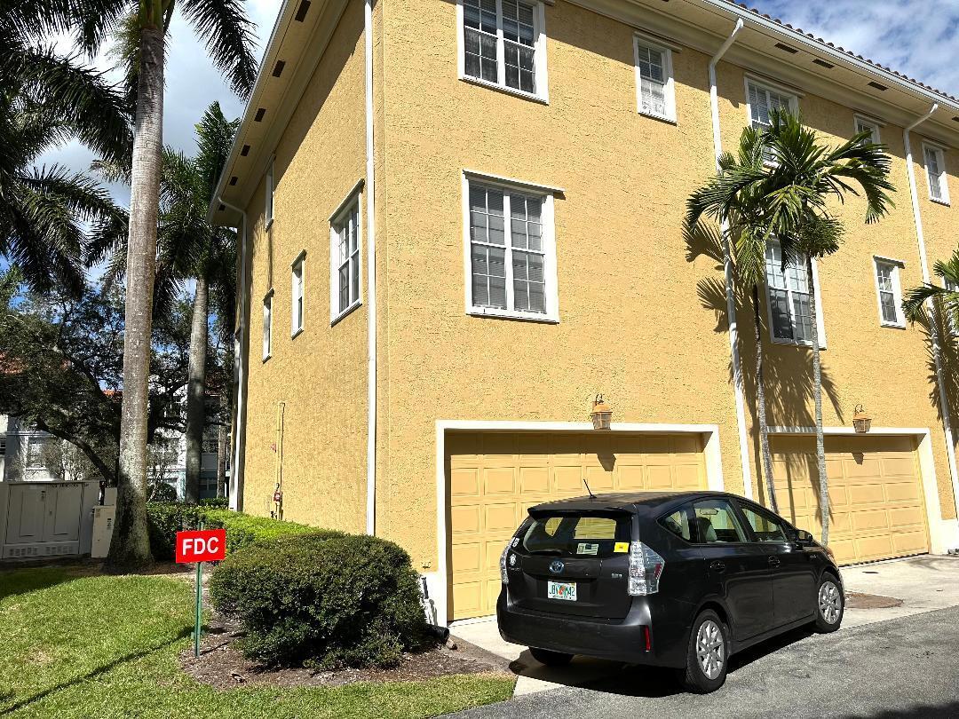 808 University Boulevard Jupiter, FL 33458 - Photo 15 of 16 a view of a car parked in front of a house