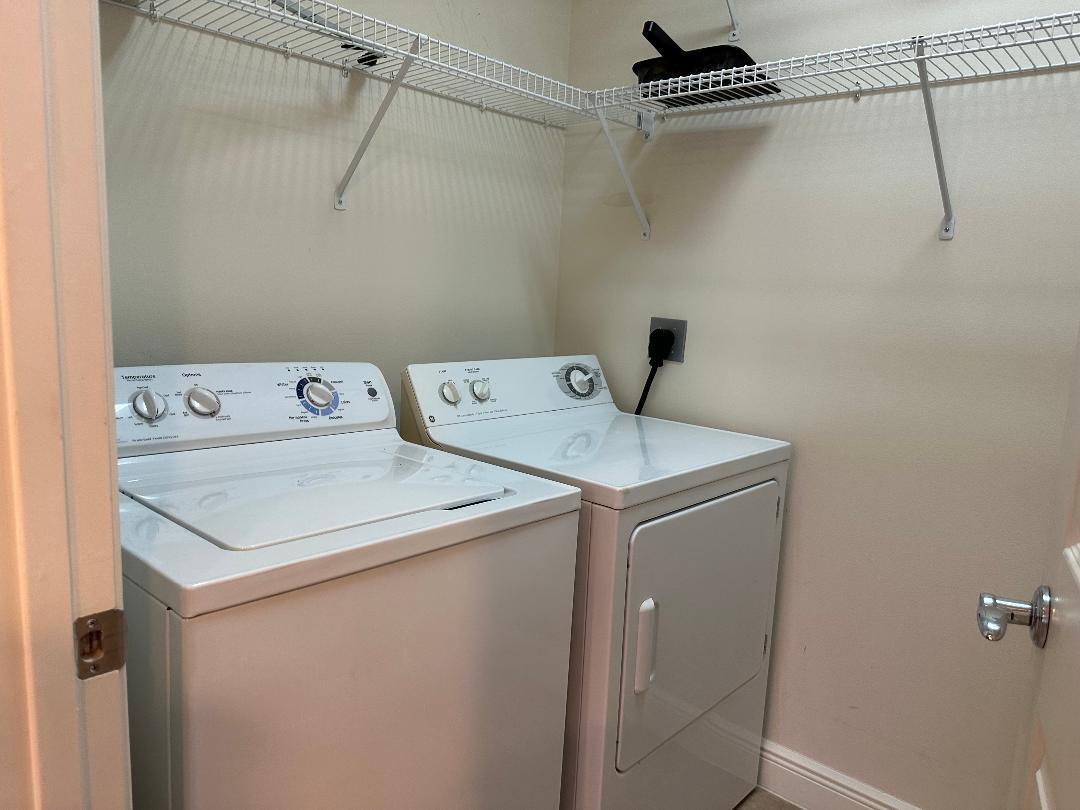 808 University Boulevard Jupiter, FL 33458 - Photo 8 of 16 a utility room with dryer and washer